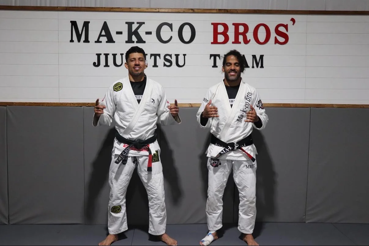 Instructor coaching a student through technique at Tampa Jiu Jitsu Academy